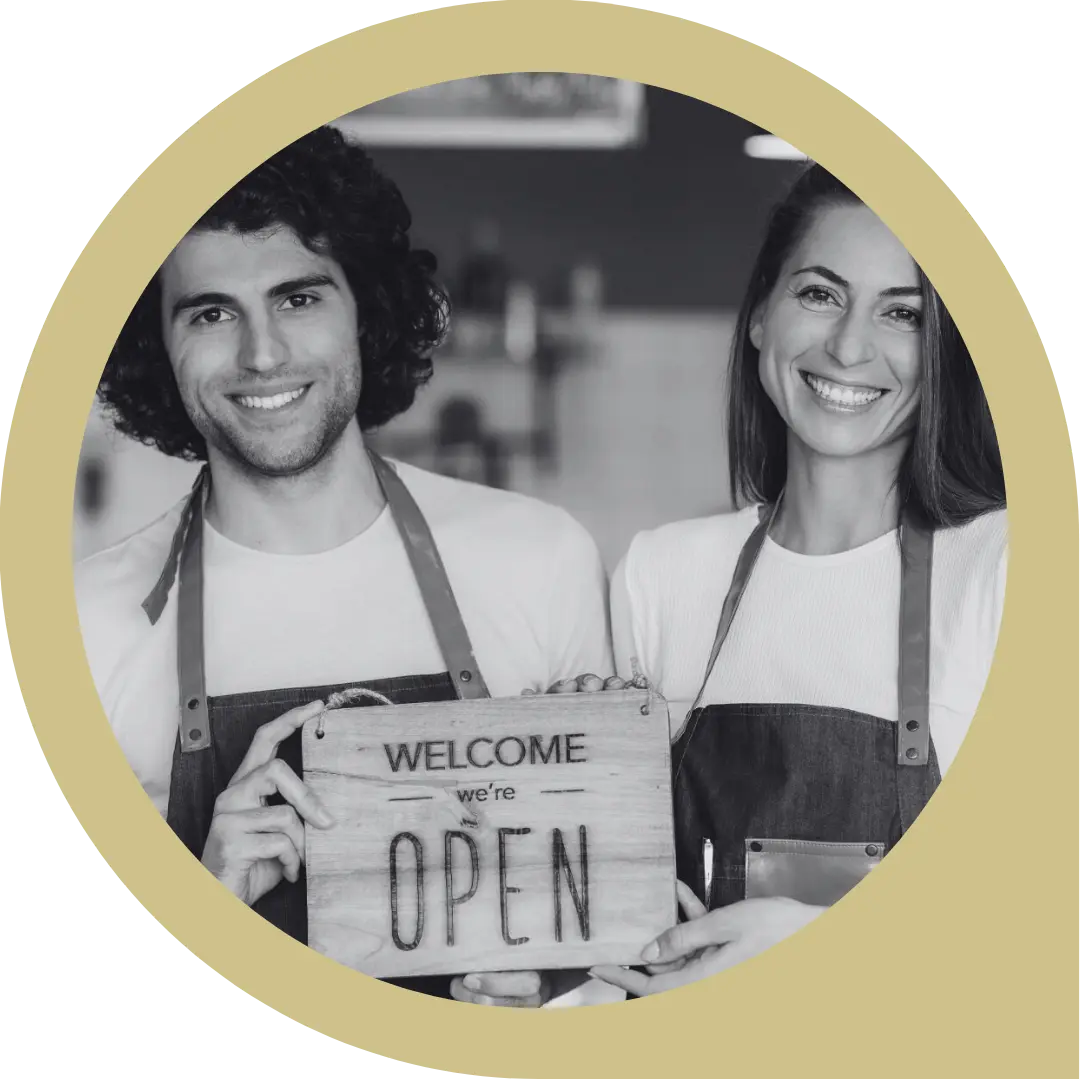 thePOSITIVE logo round (11) Couple holding an open sign - looks like a cafe